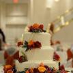 Wedding reception cake with fresh flowers:roses,freesia,godetia